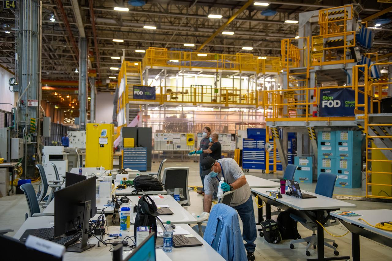 Employees wear personal protective gear at  Michoud Assembly Facility as the facility transitioned to Stage 3 of NASA’s Framework for Return To On-Site Work. Employees wear the appropriate personal protective equipment (PPE) and/or cloth face coverings as required for assigned tasks. Access to the facility is limited to authorized personnel working on mission-critical tasks that must be conducted onsite. Mission-critical tasks include slowly and methodically resuming Space Launch System (SLS) Core Stage and Orion production activities, particularly critical path deliverables to support the Artemis Program, at a pace that limits personnel and follows federal guidelines for social distancing and use of personal protective equipment such as face masks. For more information about SLS, visit nasa.gov/sls.